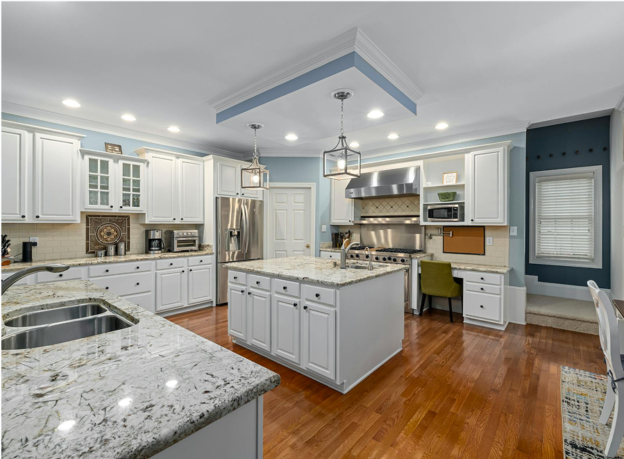 Premium Stones kitchen featuring elegant granite countertops and a spacious island.