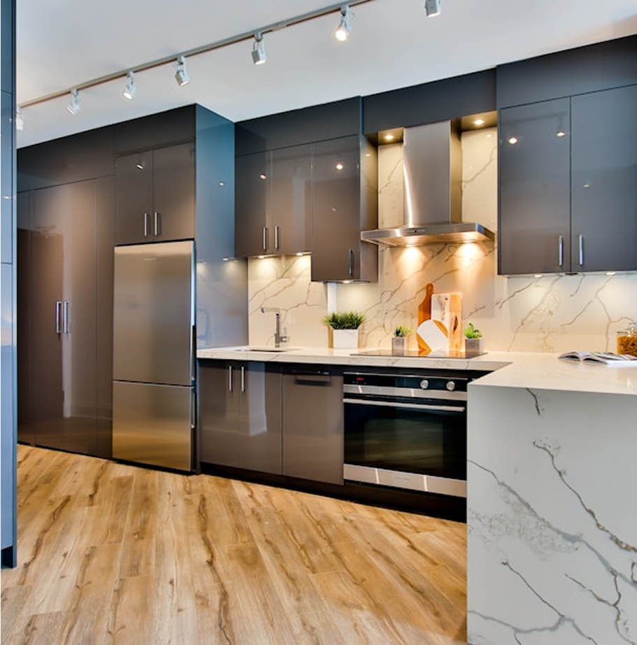 Premium Stones white marble countertops and backsplash in a modern kitchen.