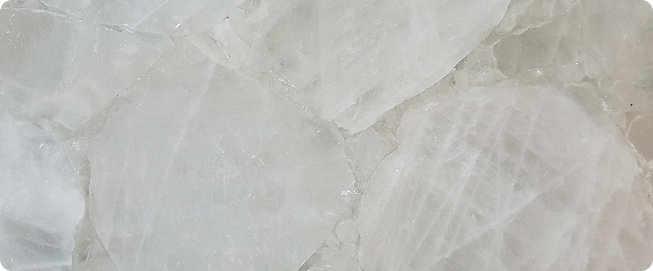 Premium Stones – Elegant white quartz stone with natural crystal formations, perfect for luxurious interiors.